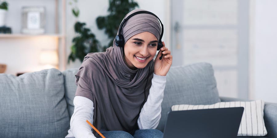 Women attending a webinar in her home